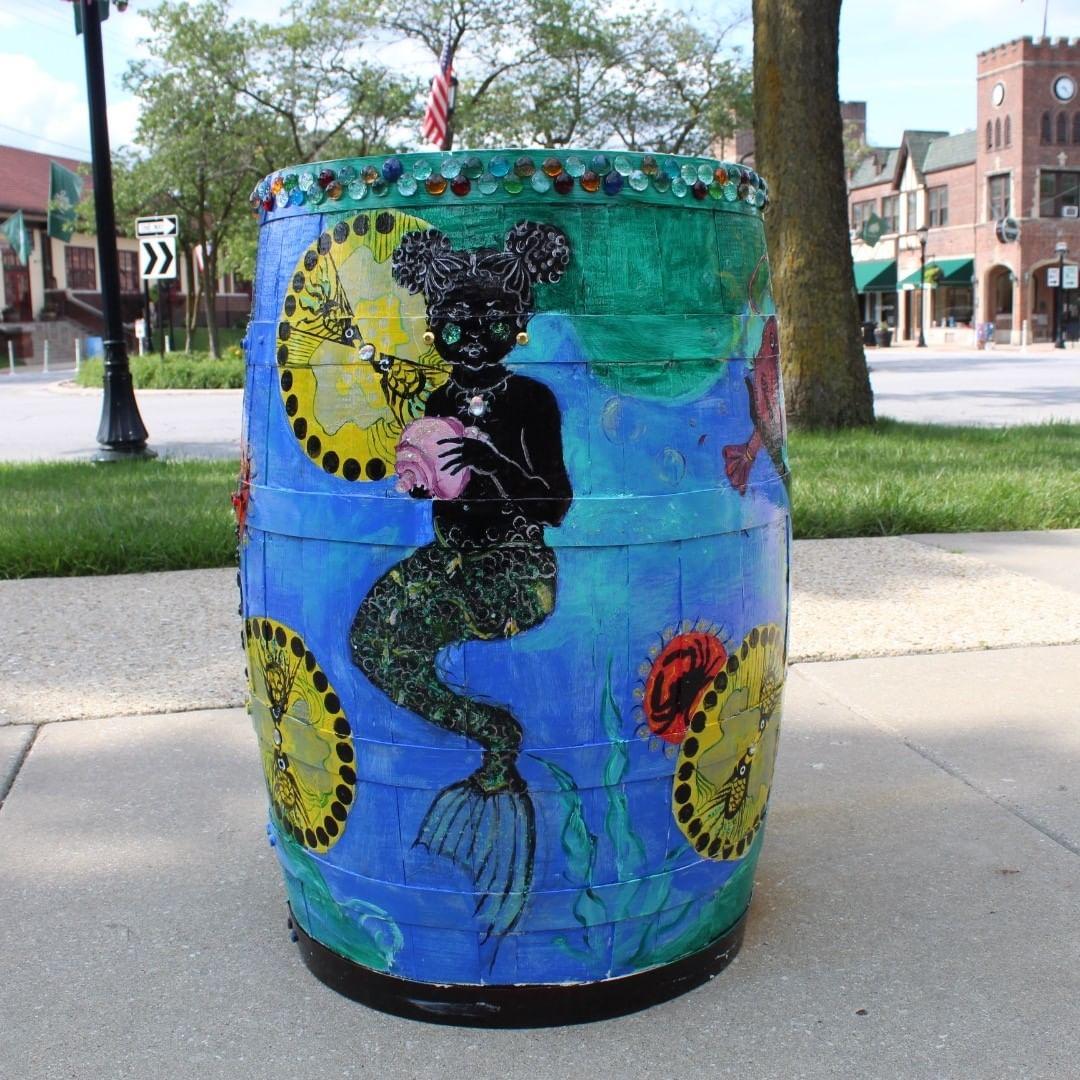 “Mami Wata Wishing Barrel” by Flossmoor artist Kyrin Hobson by Library - Barrels of Hope Public Art Program