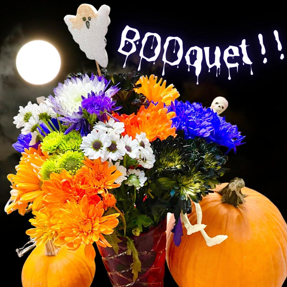 Halloween Flower Bouquet - purple, black, and orange colored flowers.